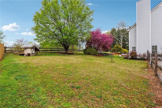 8450 Jot Em Down Rd, Gainesville, GA 30506 - view of yard with a fenced backyard and an outbuilding