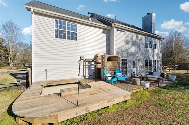 8450 Jot Em Down Rd, Gainesville, GA 30506 - rear view of house featuring outdoor lounge area, a chimney, fence, and a deck