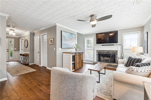 8450 Jot Em Down Rd, Gainesville, GA 30506 - living area featuring crown molding, baseboards, ceiling fan, and dark wood-style floors