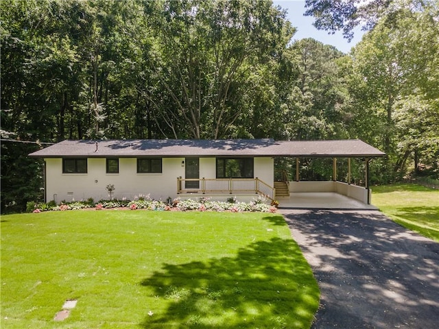 3620 W Lawrenceville St, Duluth, GA 30096 - view of front of home featuring a front yard, driveway, and an attached carport