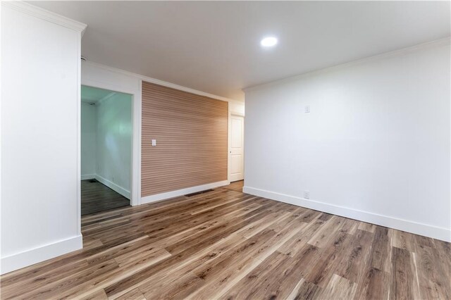 3620 W Lawrenceville St, Duluth, GA 30096 - spare room with crown molding, wood finished floors, and recessed lighting