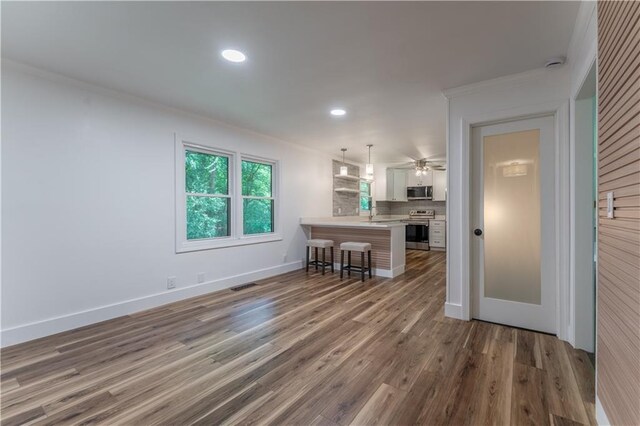 3620 W Lawrenceville St, Duluth, GA 30096 - living room featuring ornamental molding, wood finished floors, recessed lighting, and ceiling fan