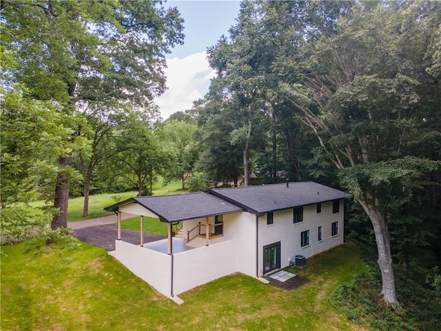 3620 W Lawrenceville St, Duluth, GA 30096 - view of home's exterior featuring a yard, stucco siding, and a shingled roof