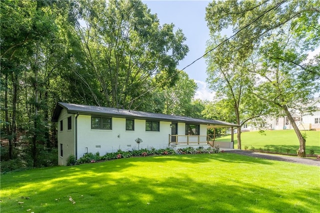 3620 W Lawrenceville St, Duluth, GA 30096 - view of front of home with a front yard, brick siding, asphalt driveway, and a carport