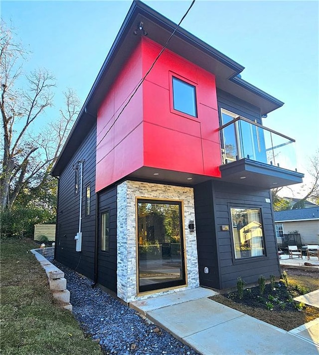 contemporary home with a balcony