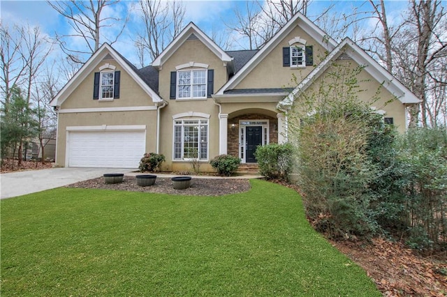 view of front of home featuring a garage and a front lawn