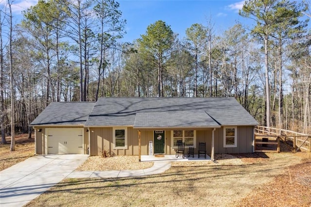 ranch-style house with covered porch and a garage