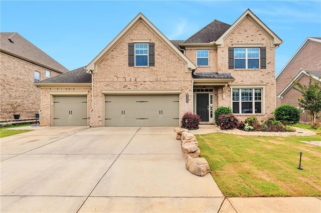 4708 Tiger Blvd, Duluth, GA 30096 - view of front facade featuring brick siding, driveway, a front lawn, and a garage