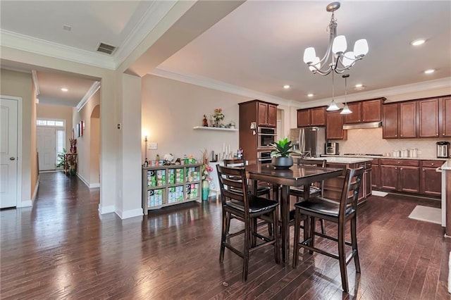4708 Tiger Blvd, Duluth, GA 30096 - dining space featuring a chandelier, dark wood-style floors, baseboards, ornamental molding, and recessed lighting