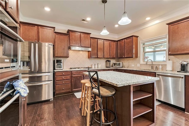 4708 Tiger Blvd, Duluth, GA 30096 - kitchen with stainless steel appliances, under cabinet range hood, a sink, dark wood-style flooring, and open shelves