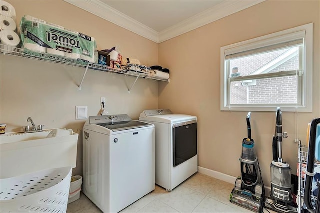4708 Tiger Blvd, Duluth, GA 30096 - laundry room featuring washing machine and clothes dryer, ornamental molding, baseboards, and light tile patterned floors