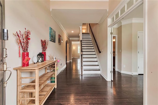 4708 Tiger Blvd, Duluth, GA 30096 - foyer entrance with crown molding, arched walkways, stairway, hardwood / wood-style flooring, and baseboards