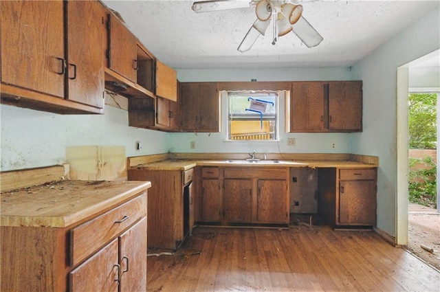 1352 Overlook Cv SE, Smyrna, GA 30080 - kitchen with dark wood-style flooring, a ceiling fan, brown cabinetry, and light countertops