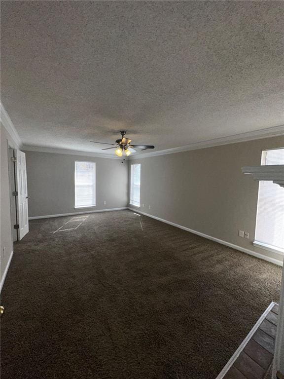 carpeted spare room with crown molding, a textured ceiling, and ceiling fan