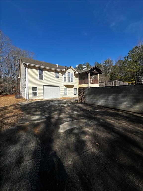 view of side of home with a garage