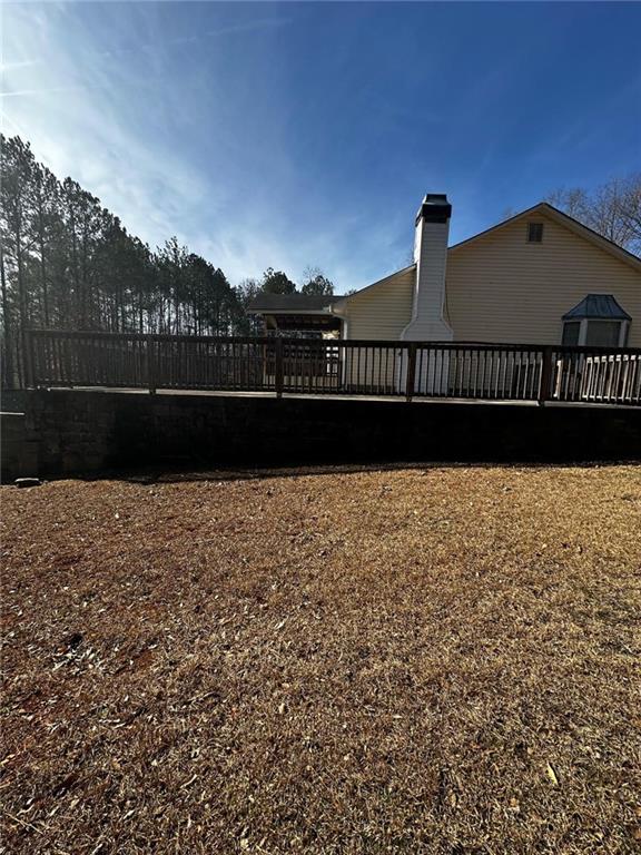 view of yard featuring a wooden deck