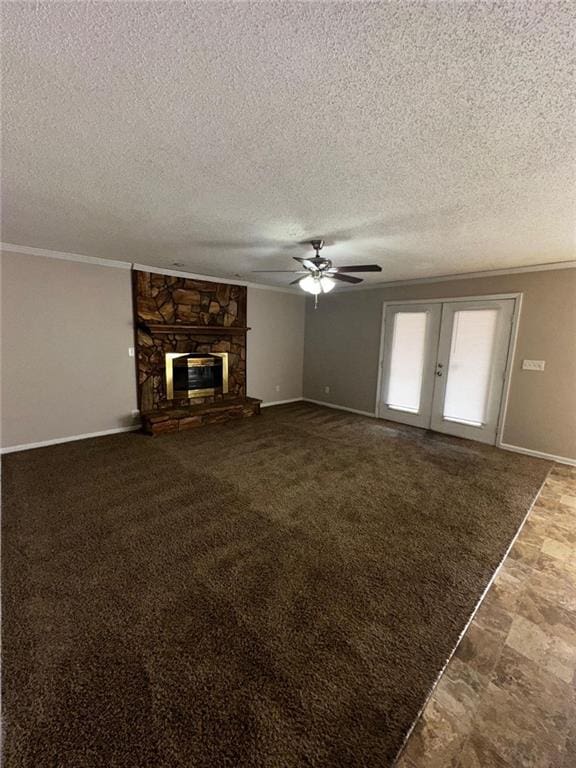 unfurnished living room with a fireplace, ornamental molding, french doors, and a textured ceiling