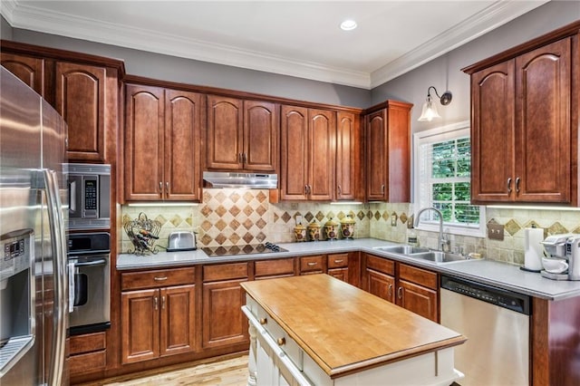 3150 Stonewyck Pl, Decatur, GA 30033 - kitchen featuring stainless steel appliances, a sink, under cabinet range hood, wooden counters, and recessed lighting