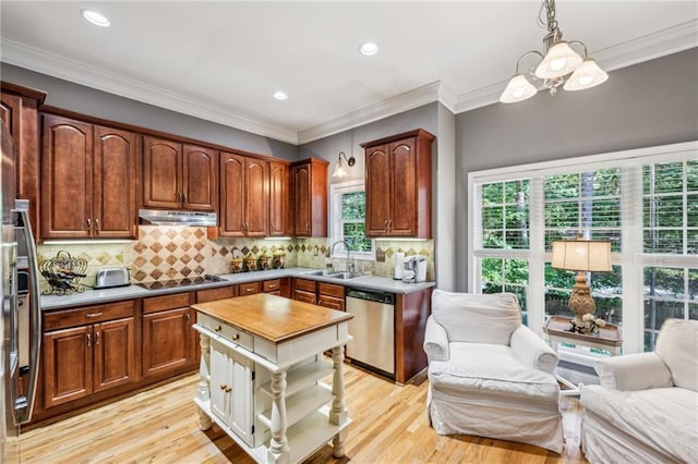 3150 Stonewyck Pl, Decatur, GA 30033 - kitchen with dishwasher, a sink, open floor plan, under cabinet range hood, and light wood finished floors