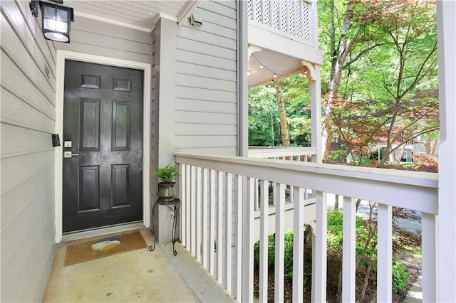 view of exterior entry featuring a porch