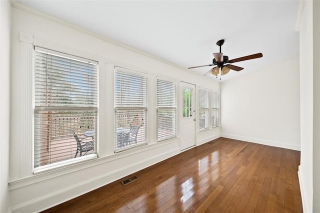 unfurnished room featuring hardwood / wood-style floors and ceiling fan