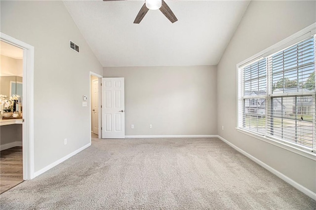 3710 Ridgefair Dr, Cumming, GA 30040 - unfurnished bedroom with vaulted ceiling, carpet floors, ceiling fan, and ensuite bathroom