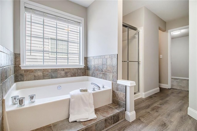 3710 Ridgefair Dr, Cumming, GA 30040 - bathroom with a bath, wood finished floors, and a shower stall