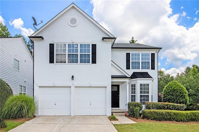 3710 Ridgefair Dr, Cumming, GA 30040 - traditional-style home with stucco siding, concrete driveway, a garage, and a standing seam roof