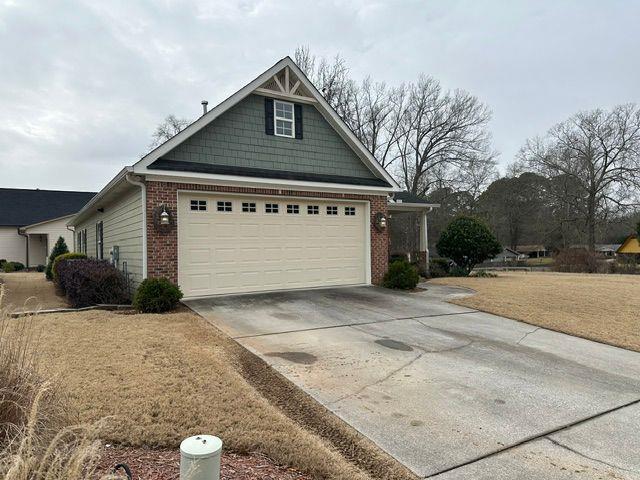 view of property exterior featuring a garage