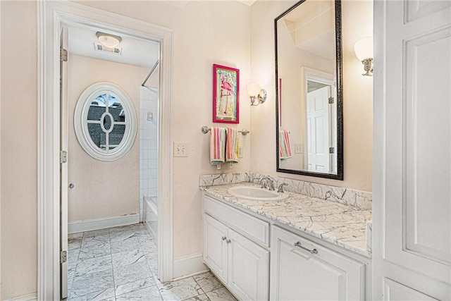 full bath with visible vents, baseboards, shower / bath combination, marble finish floor, and vanity