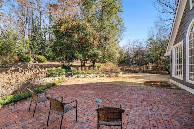 view of patio / terrace featuring fence