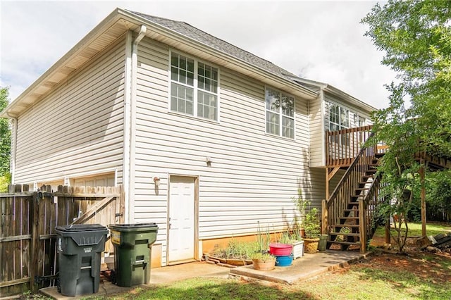 68 Paradise Pointe, Douglasville, GA 30134 - back of property with fence, a deck, and stairway