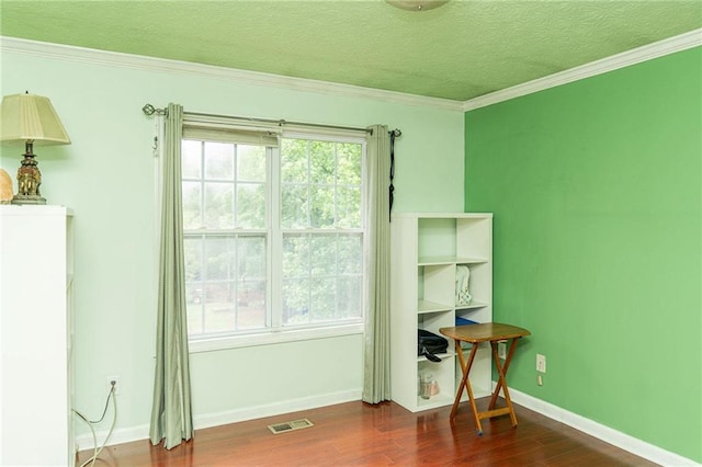 68 Paradise Pointe, Douglasville, GA 30134 - spare room featuring wood finished floors, a textured ceiling, baseboards, and ornamental molding