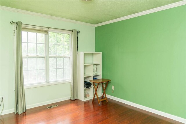 68 Paradise Pointe, Douglasville, GA 30134 - unfurnished room featuring dark wood-style floors, crown molding, a textured ceiling, and baseboards