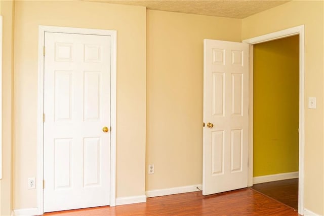68 Paradise Pointe, Douglasville, GA 30134 - unfurnished bedroom with dark wood-style flooring and baseboards