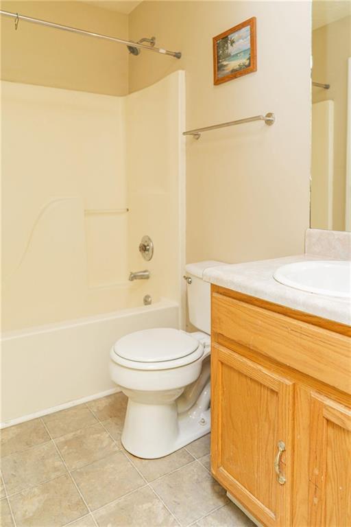 68 Paradise Pointe, Douglasville, GA 30134 - bathroom featuring shower / tub combination, toilet, vanity, and tile patterned flooring