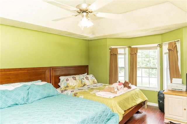 68 Paradise Pointe, Douglasville, GA 30134 - bedroom featuring dark wood-style flooring, baseboards, and a ceiling fan