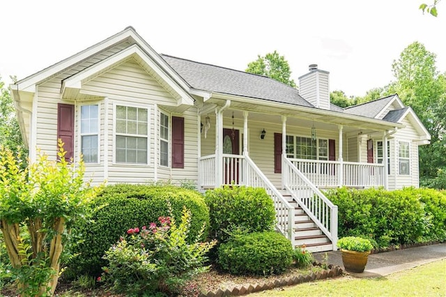 68 Paradise Pointe, Douglasville, GA 30134 - ranch-style house featuring a porch, a chimney, stairway, and roof with shingles
