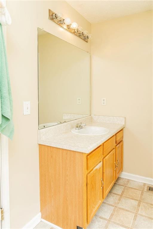 68 Paradise Pointe, Douglasville, GA 30134 - bathroom featuring vanity and baseboards
