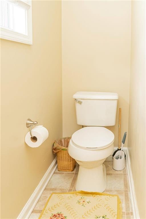 68 Paradise Pointe, Douglasville, GA 30134 - bathroom with toilet, tile patterned flooring, and baseboards