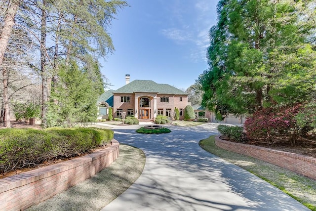 view of front of house featuring a garage and a porch