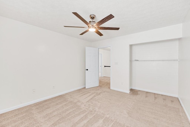 1186 Hawthorn Ln, Grayson, GA 30017 - unfurnished bedroom with light colored carpet, baseboards, a closet, and a ceiling fan