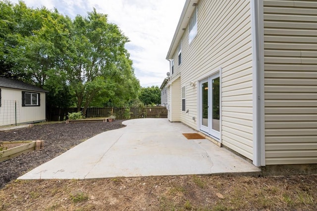 1186 Hawthorn Ln, Grayson, GA 30017 - fenced backyard with a patio and french doors
