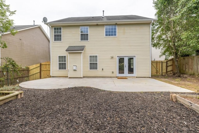 1186 Hawthorn Ln, Grayson, GA 30017 - back of property featuring a patio area, a fenced backyard, and french doors