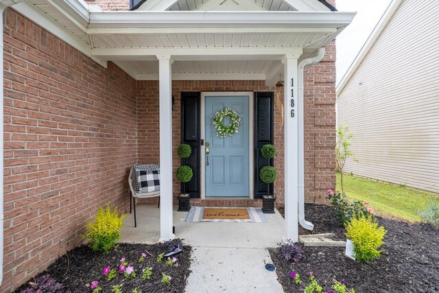 1186 Hawthorn Ln, Grayson, GA 30017 - property entrance featuring brick siding