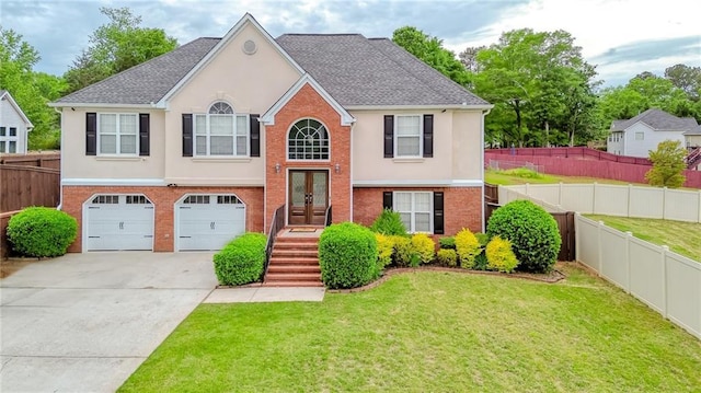 raised ranch featuring a front lawn, stucco siding, and french doors