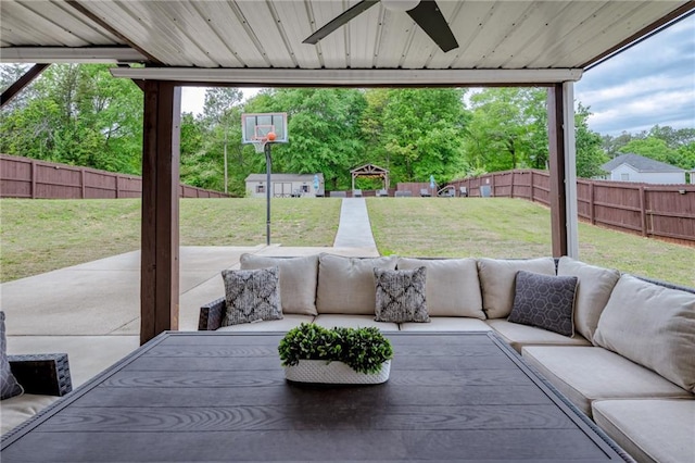 view of patio / terrace with ceiling fan, an outdoor living space, and a fenced backyard
