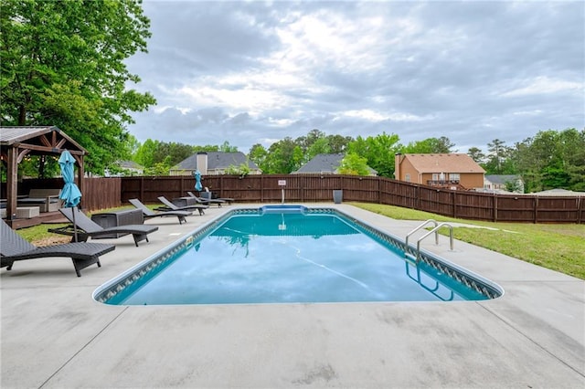 view of swimming pool with a patio, a gazebo, a fenced backyard, and a yard