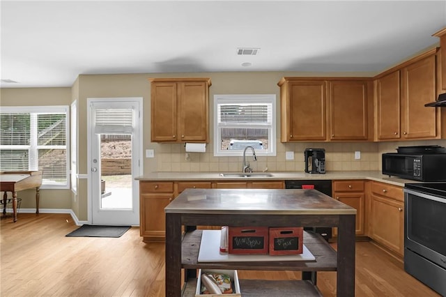1267 Castleberry Dr, Buford, GA 30518 - kitchen featuring black microwave, a sink, electric range, and light wood-type flooring