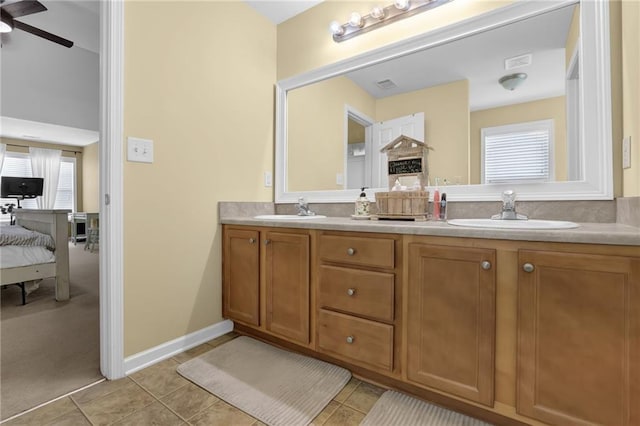 1267 Castleberry Dr, Buford, GA 30518 - ensuite bathroom with double vanity, tile patterned flooring, and a ceiling fan